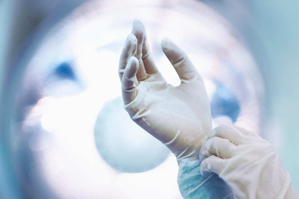 Two hands in surgical gloves 