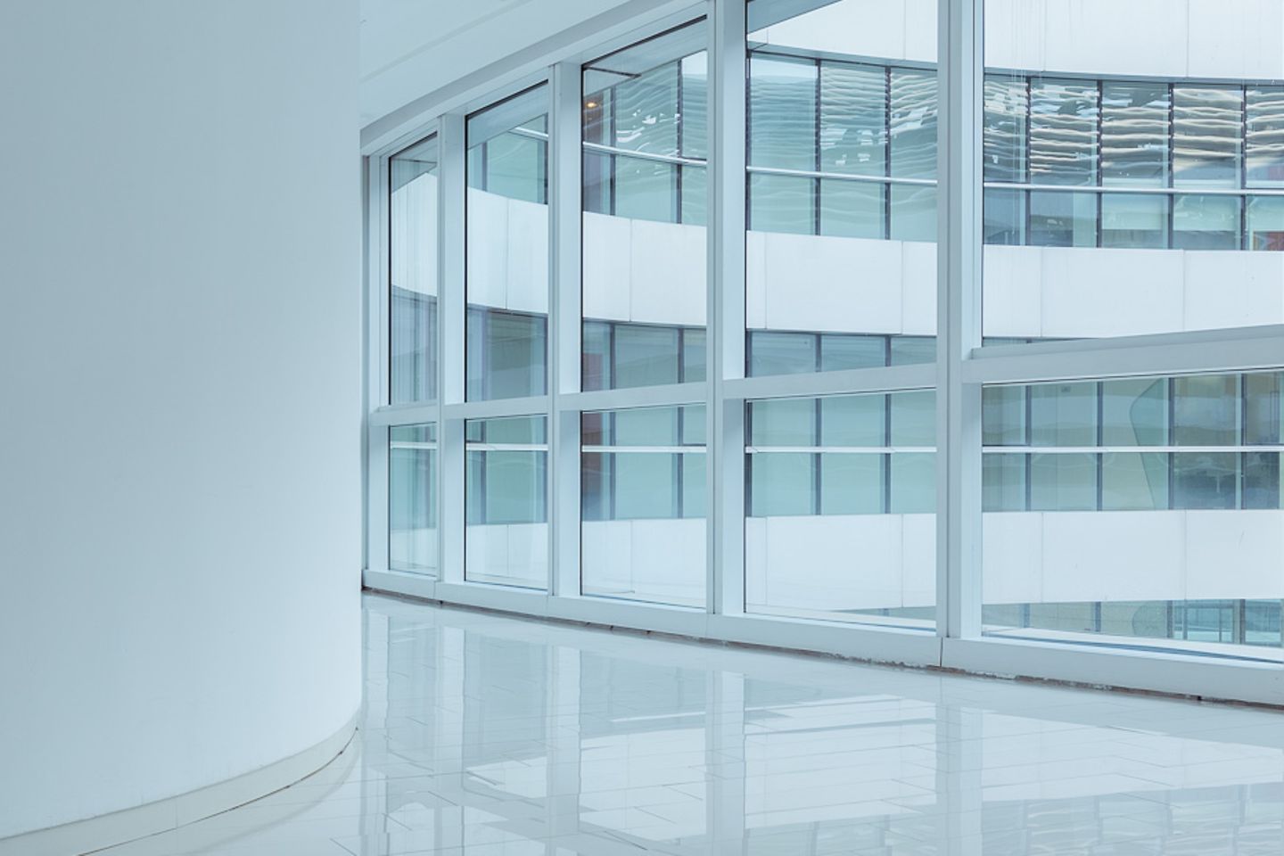 Round window within a modern building complex