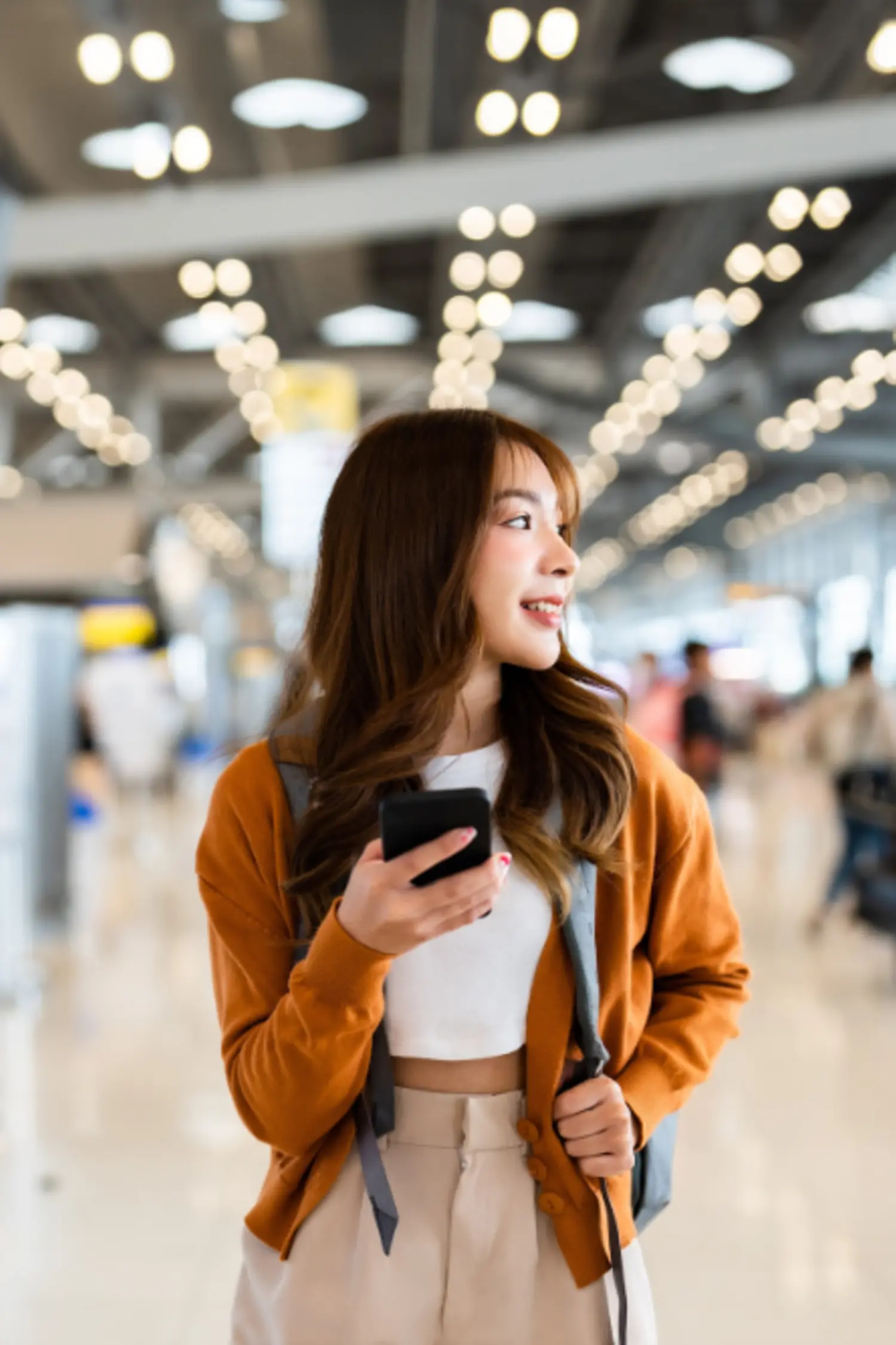 A woman exploring a modern airport