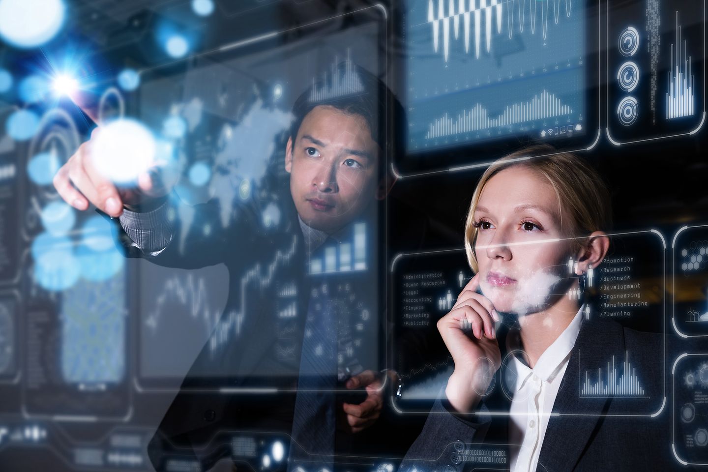 Man and woman work together on touch screen