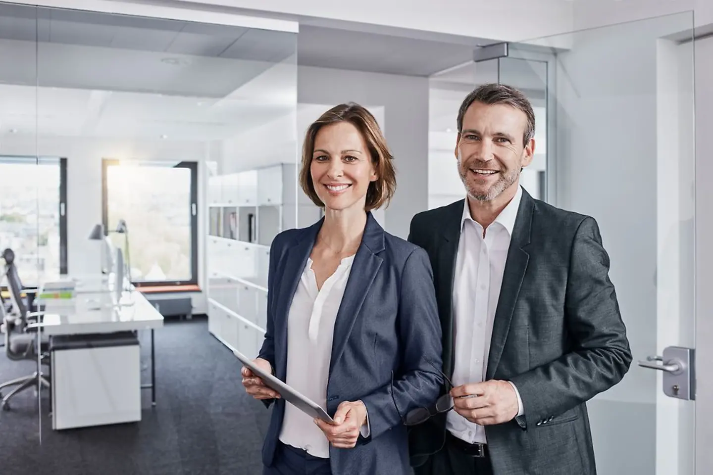 Two business partners in a modern office