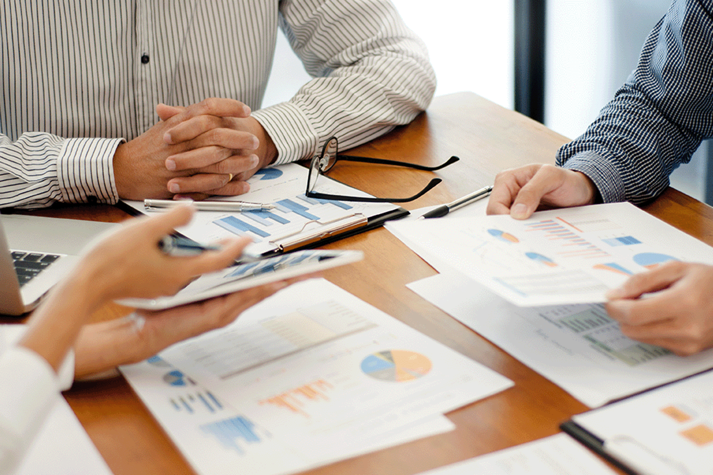 Team work discussing in valuation data in meeting room