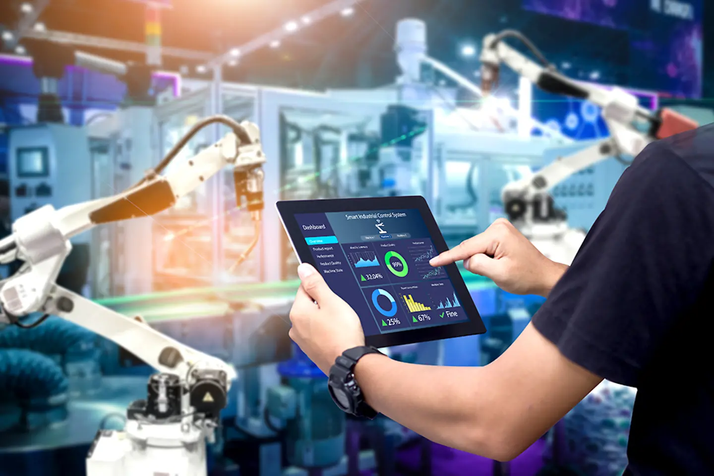 Professional working on machine data on a tablet in a factory
