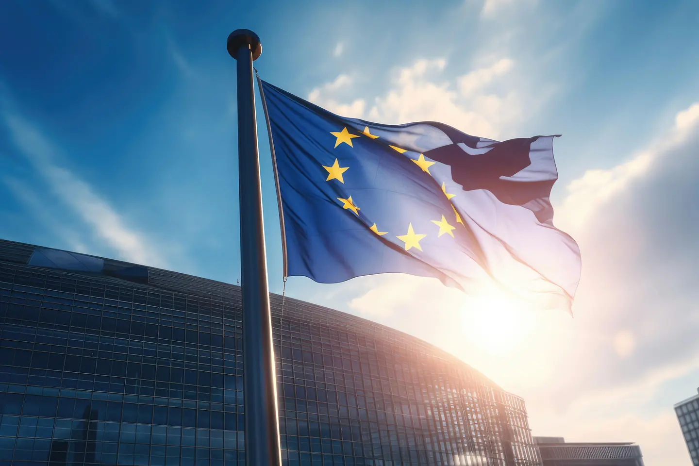 EU-Flagge weht vor einem modernen Gebäude bei Sonnenschein - AI generated/adapted