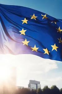 La bandera de la UE ondea frente a un edificio moderno a pleno sol - AI generated/adapted