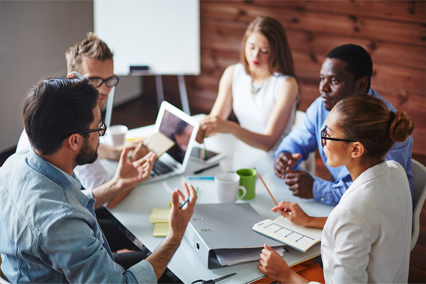 A team sitting around a table discussing ideas