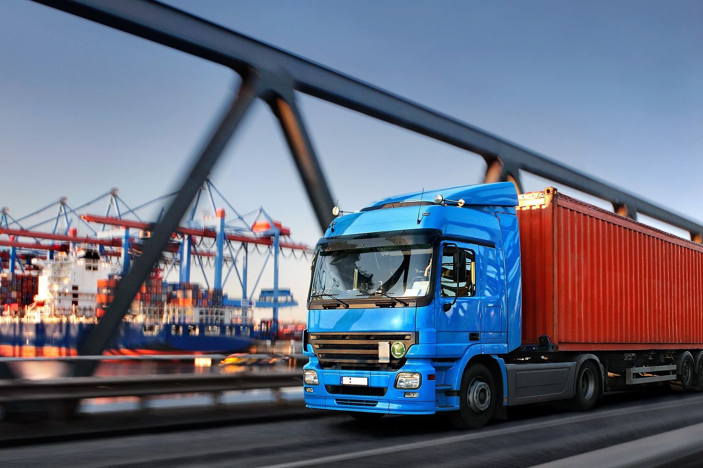 Lorry on a bridge with harbour in the background
