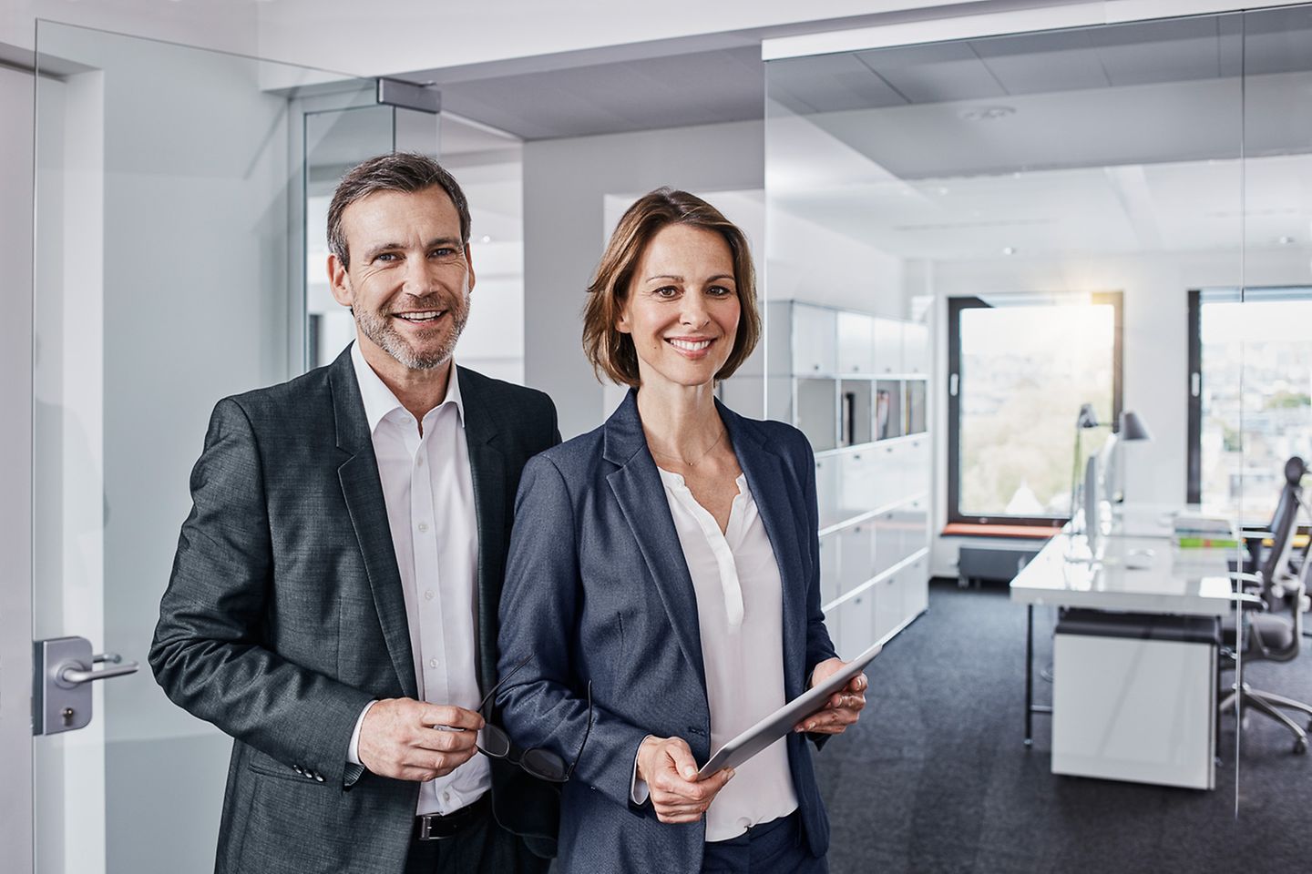 Businessman and businesswoman in the office