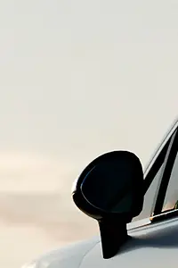 car sedan rides on the road to meet the sun