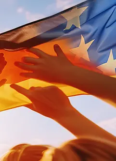 Gruppe mit Deutschland- und Europaflagge in den Händen symbolisiert Zusammenhalt
