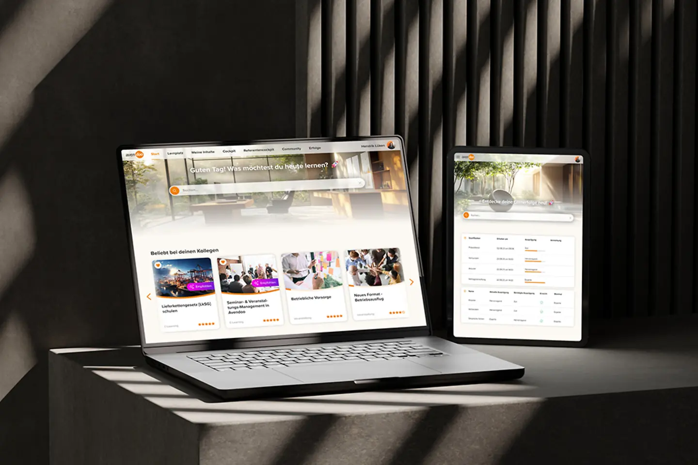 Laptop and mobile phone displaying Avendoo elearning platform