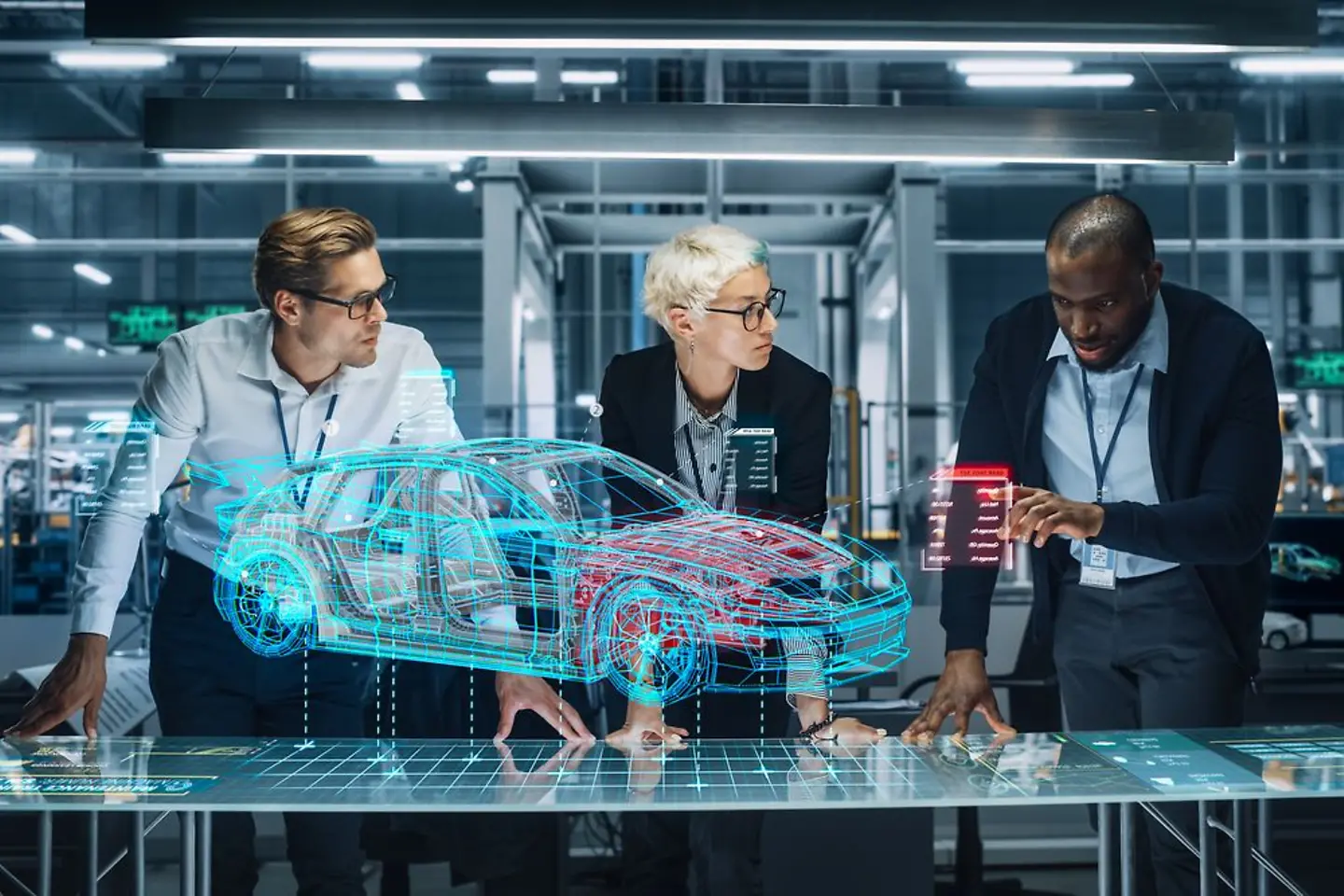 Automotive engineers working on a virtual car model