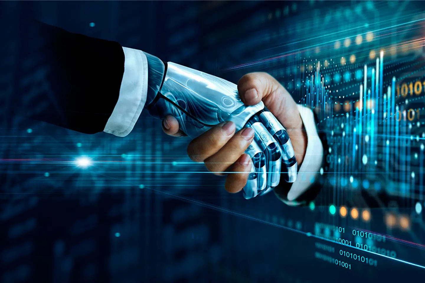 Human and robotic hands in a handshake