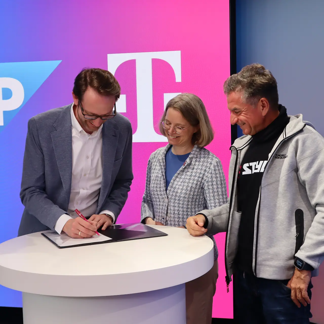 Members signing a document