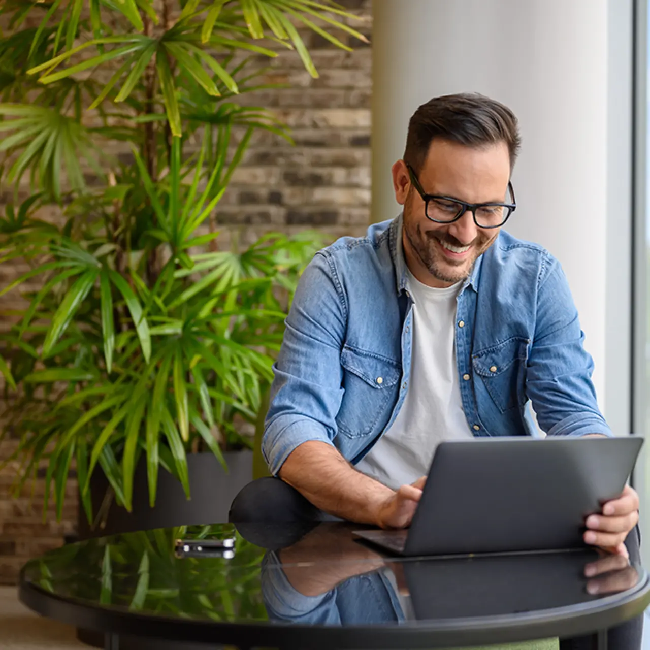 Cloud expert checking data on laptop
