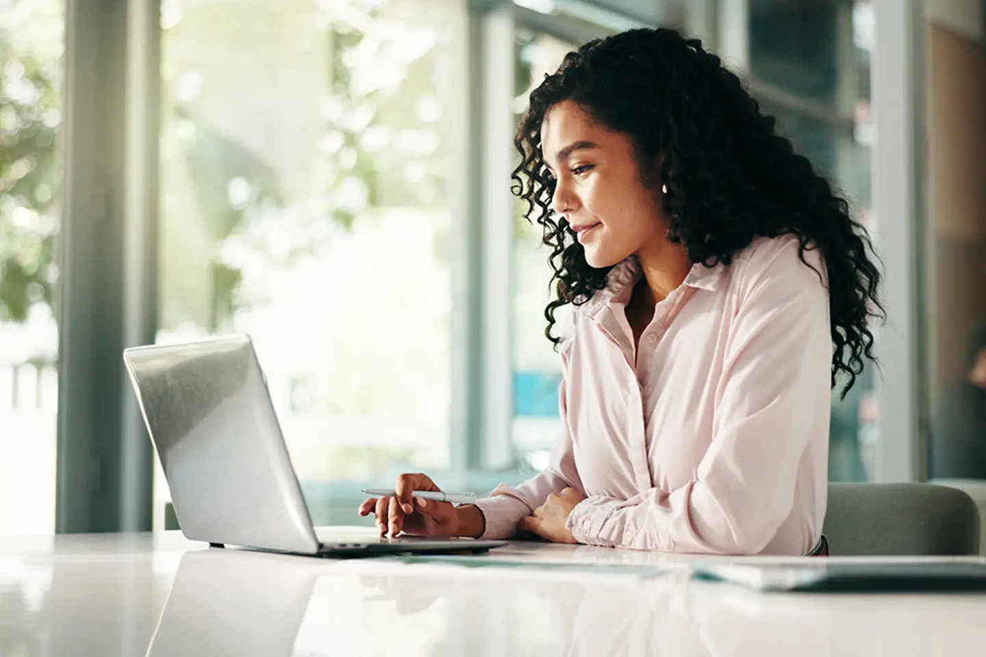 Young business woman working on her laptop