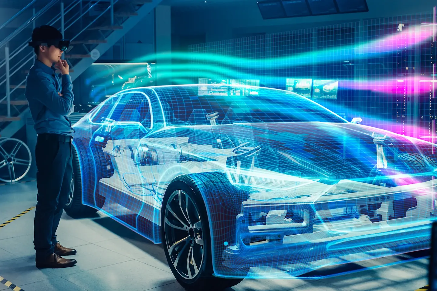 Engineer Wearing Augmented Reality Headset Working on New Electric Car Chassis Platform.