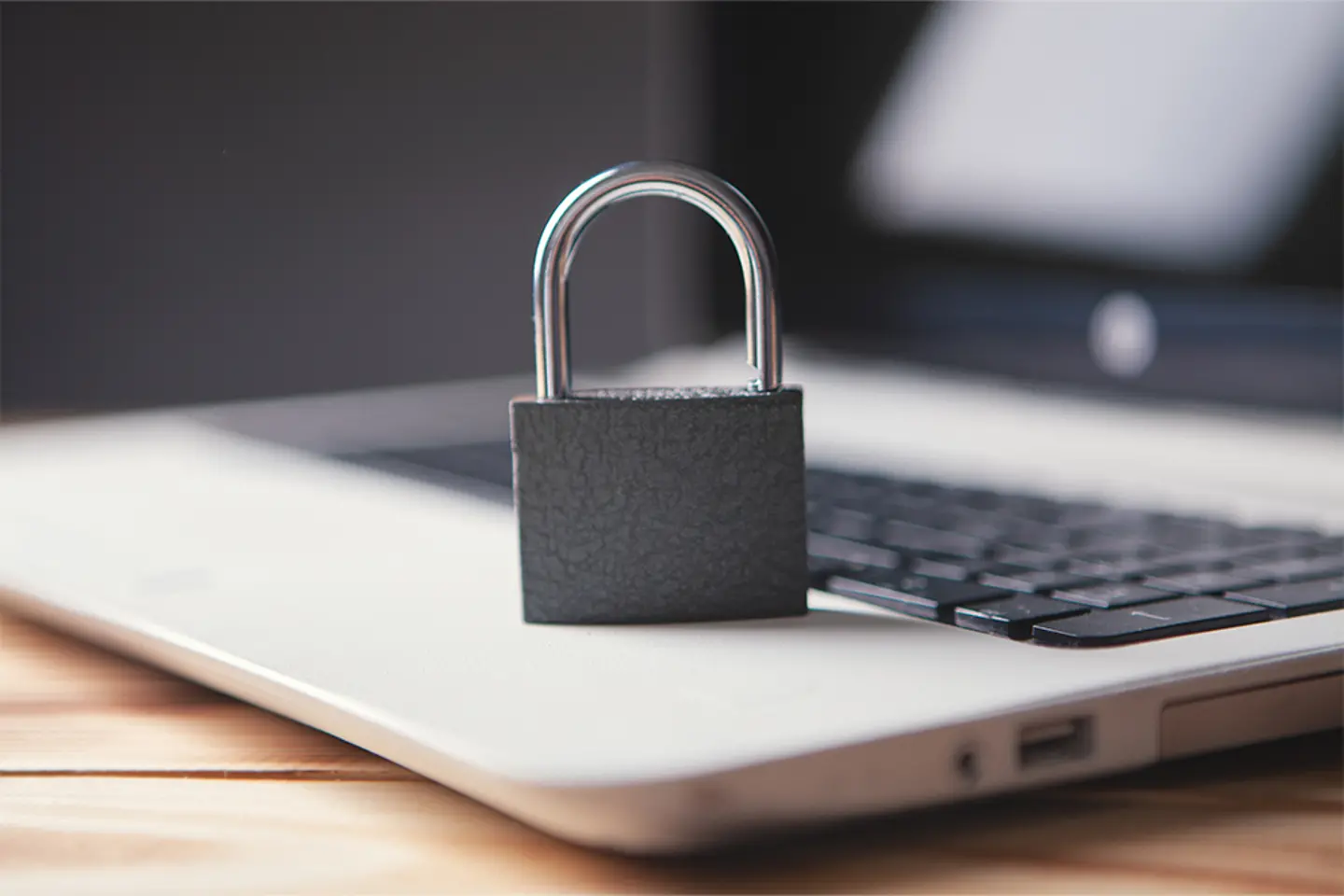 Lock on laptop as computer protection and cyber safety
