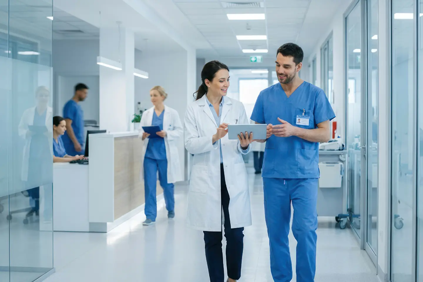 Female doctor in a laboratory using an AI-supported digital user interface to monitor patient data