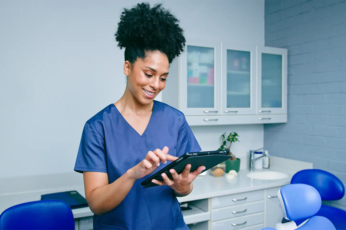 Nurse with tablet in hand