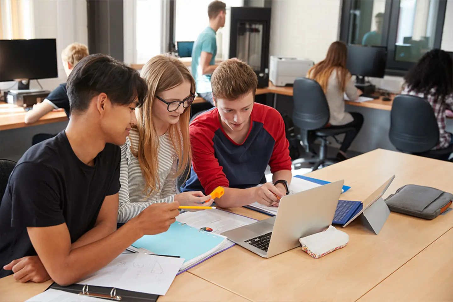 Team of young enineers solving coding task