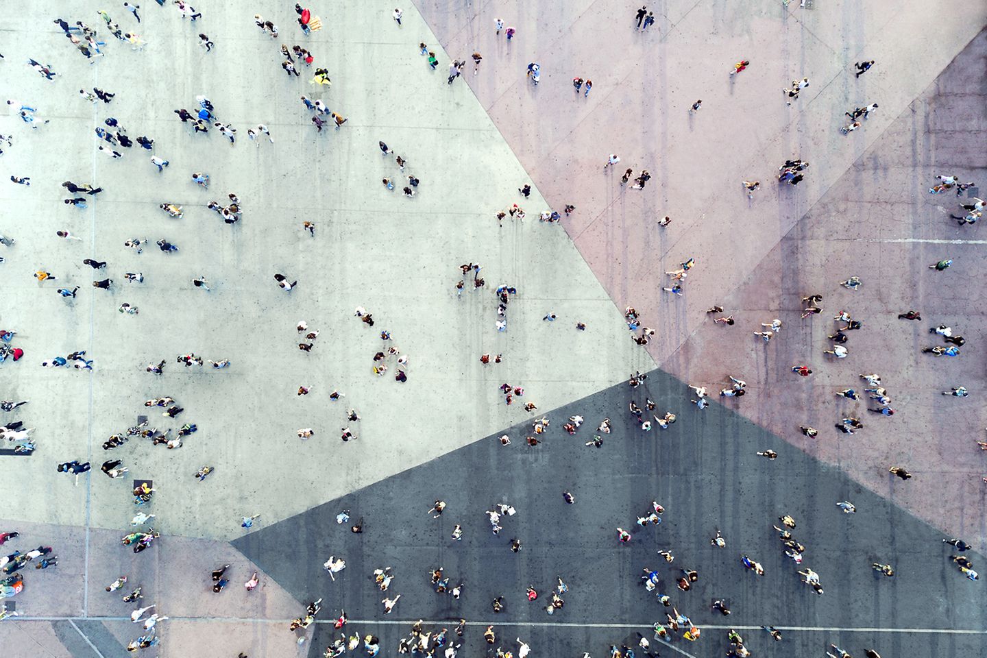 Bird's-eye view of a square with many people in motion