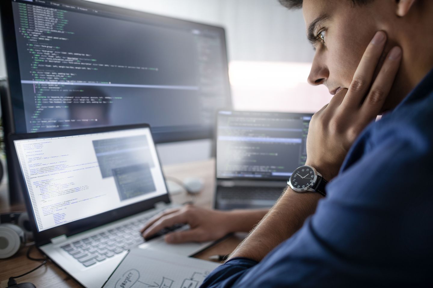 Employee checks the results software development on laptop