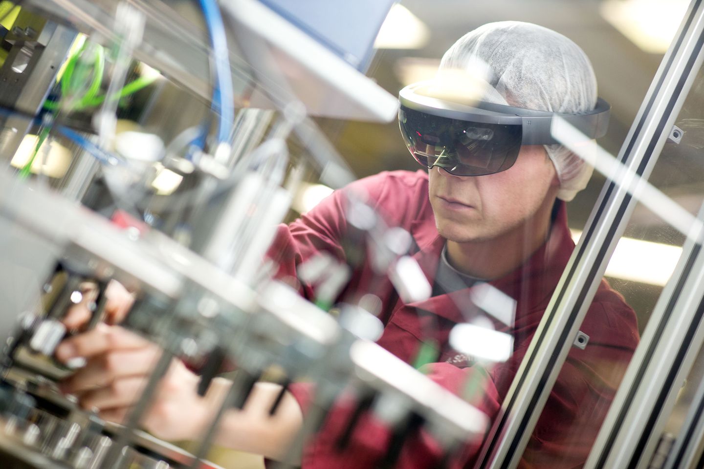 Employee with augmented reality glasses works in the lab.