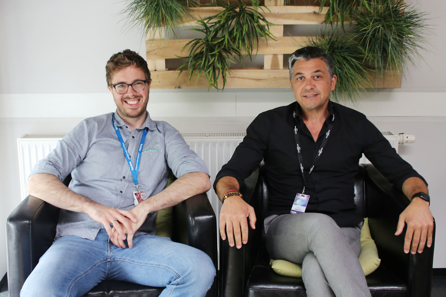 Two men sitting in armchairs.