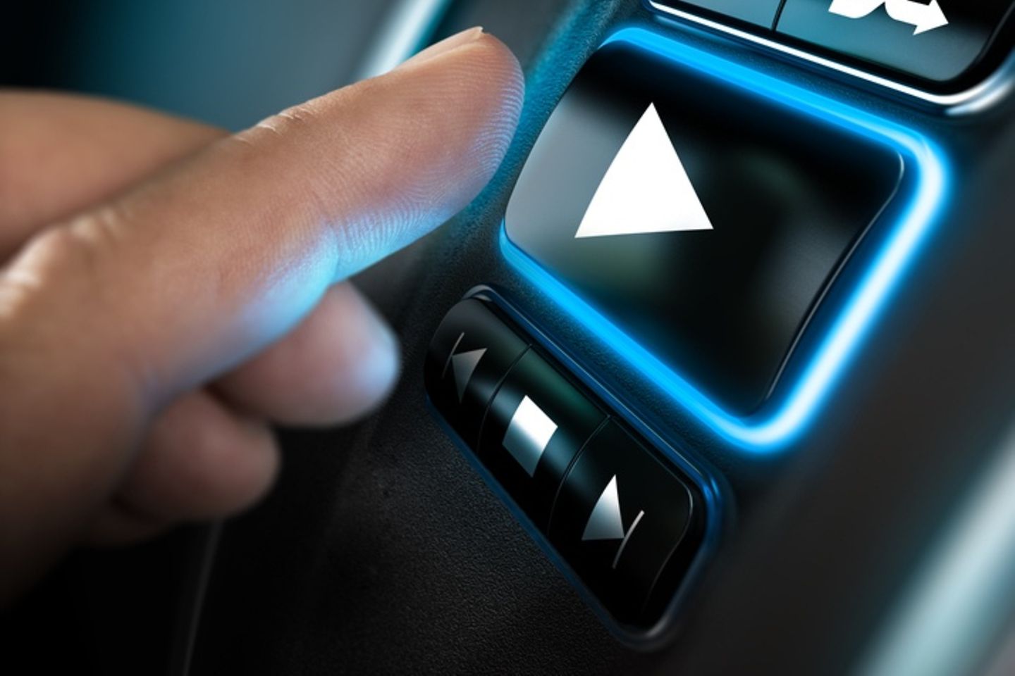 Finger that presses the play button in the car.