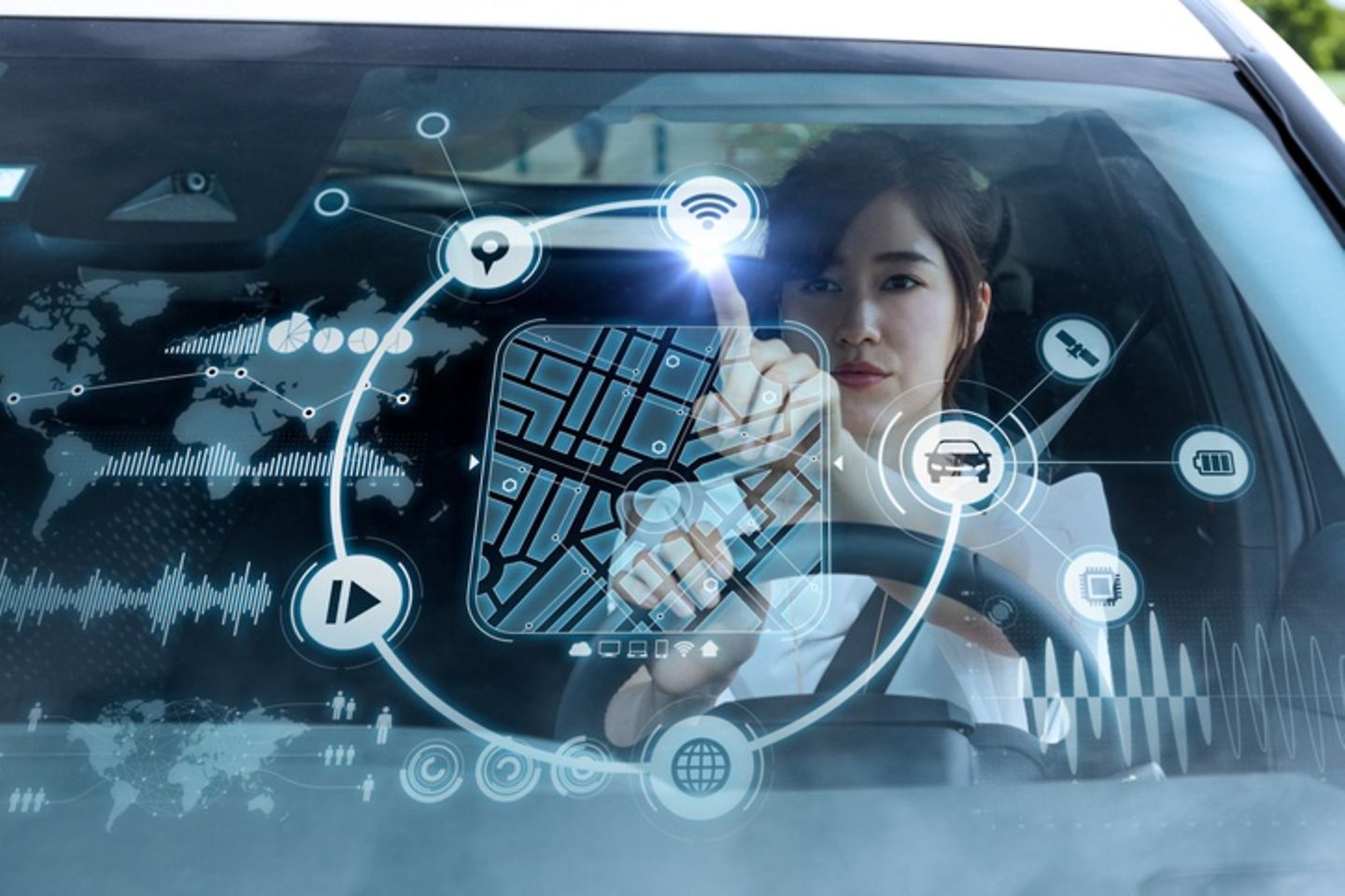 Woman tapping digital icons on the windshield of a car.