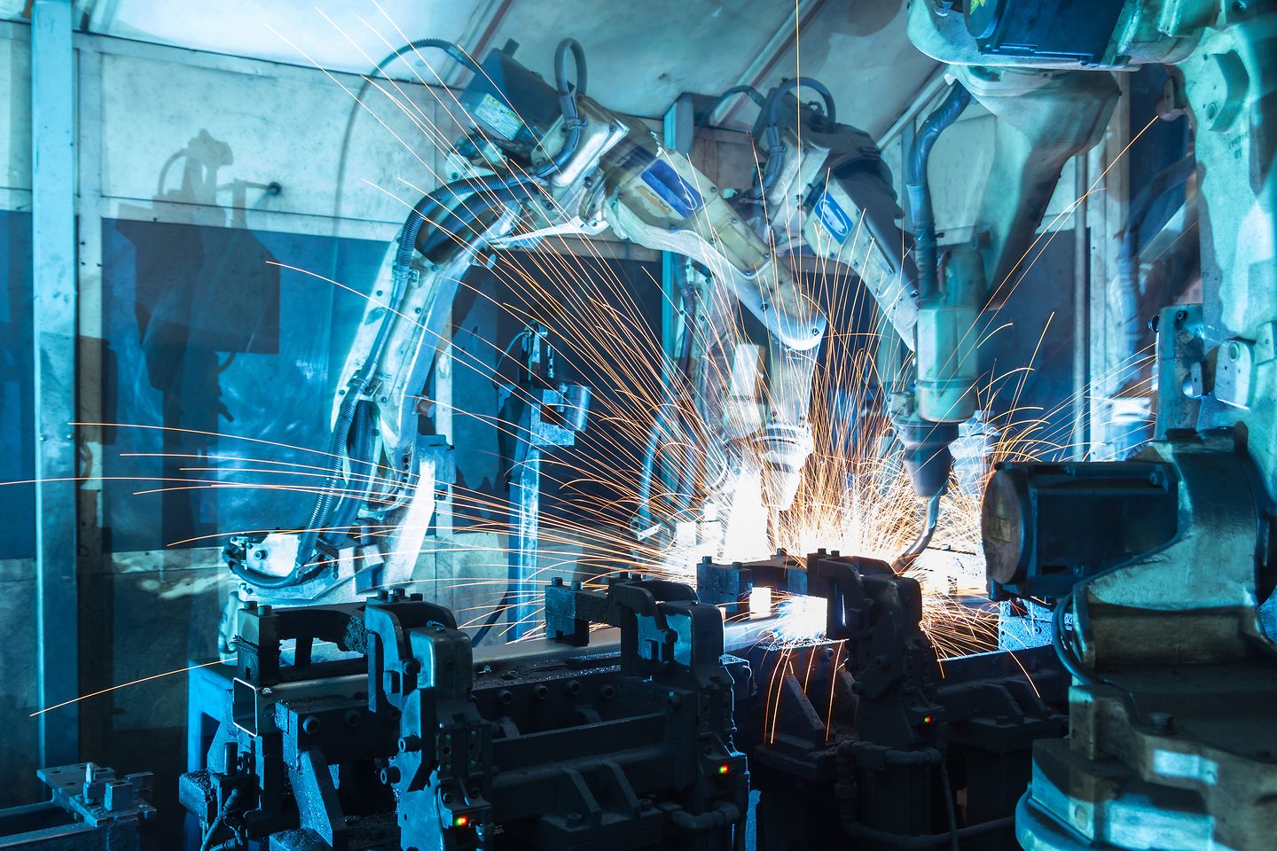 Welding robot in motion. In the automotive parts industry