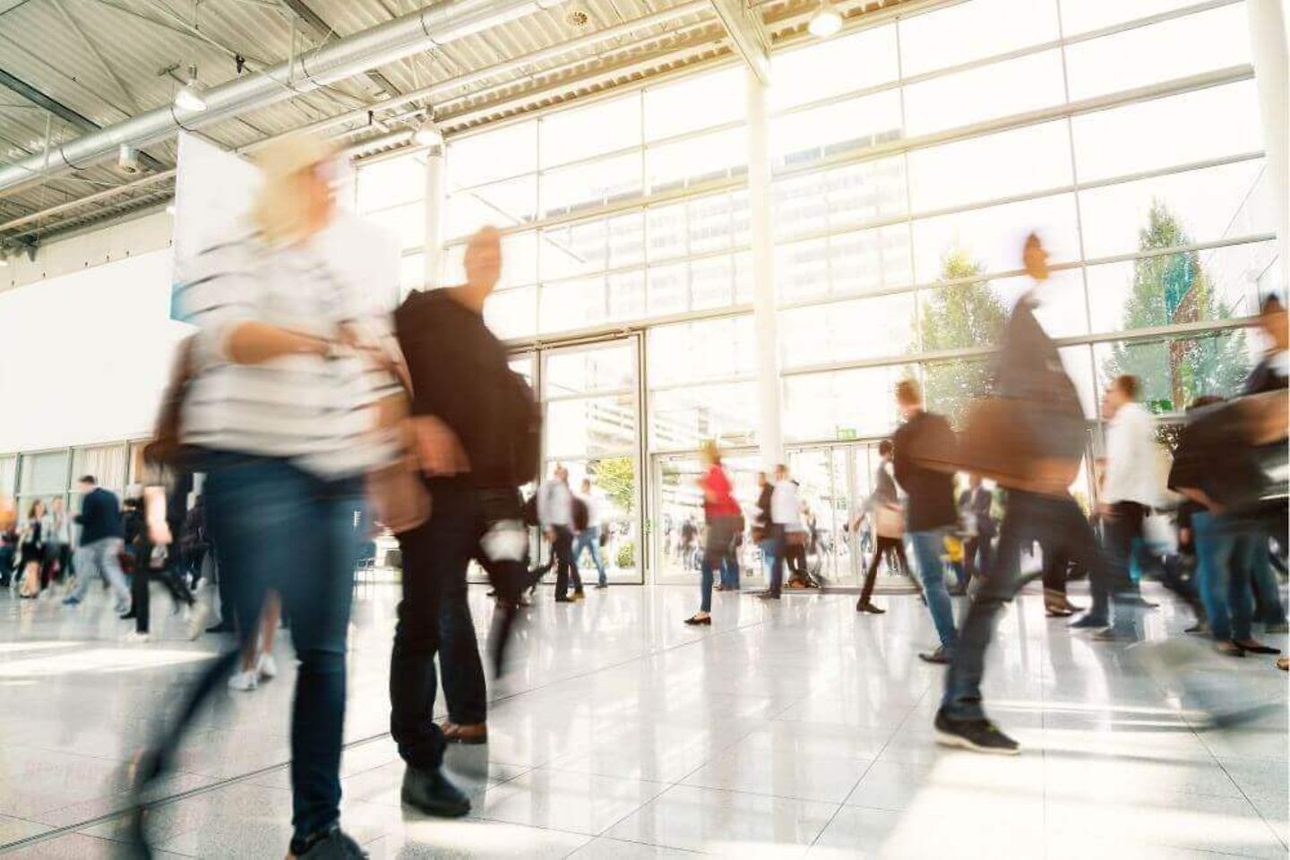 People moving through an event hall