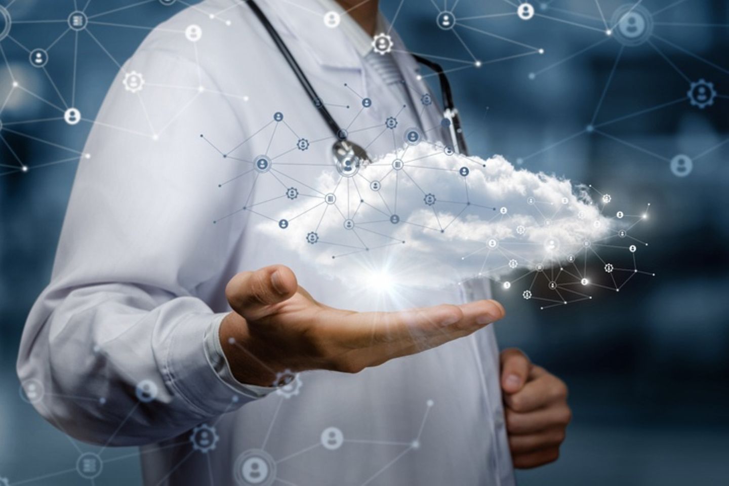 A medical professional holds a data cloud in his hand