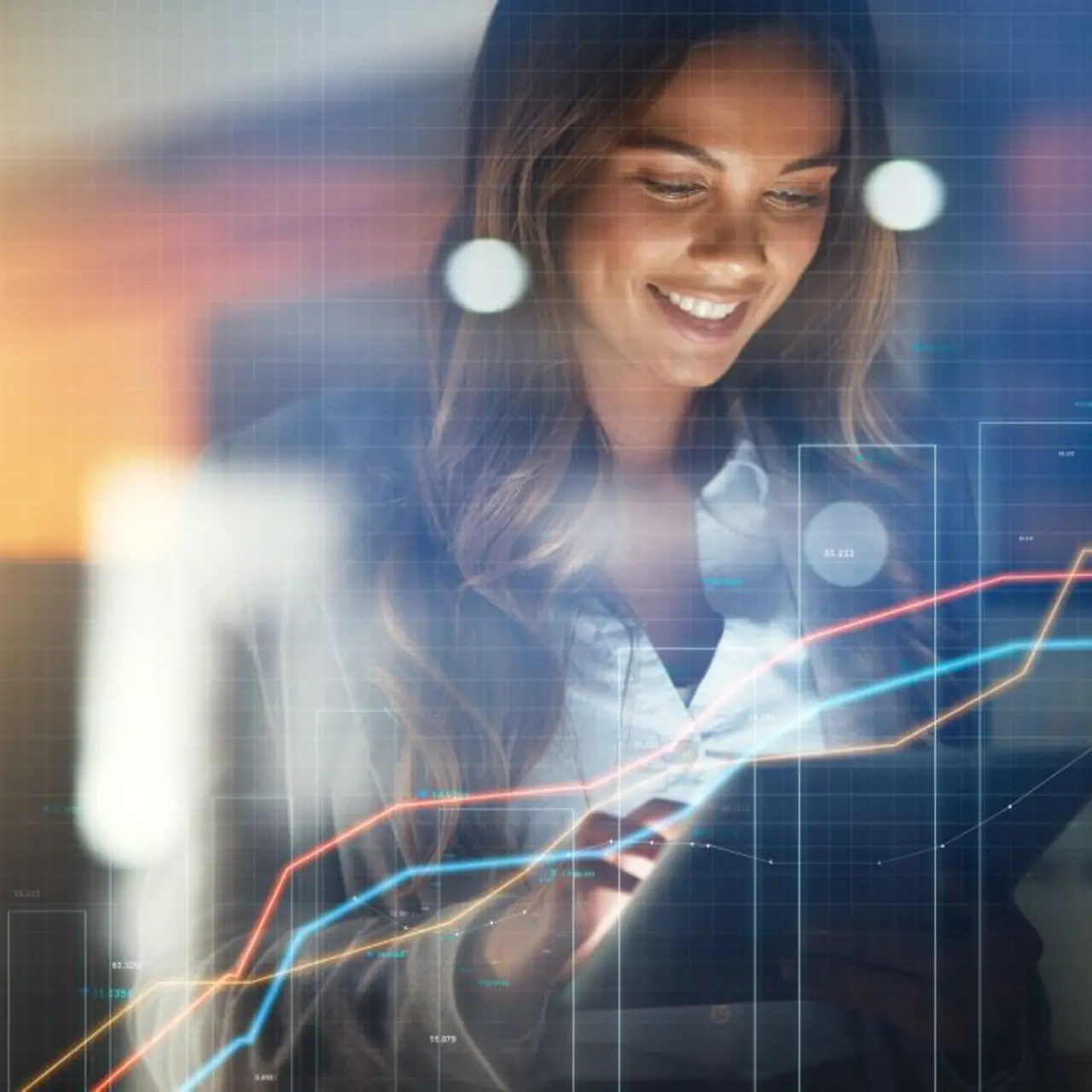  Employees analyzing a graphic on a monitor