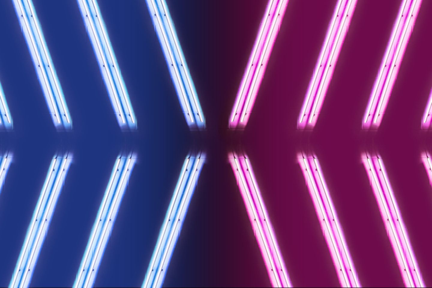 Blue and pink neon tubes which converge towards each other in an arrow shape