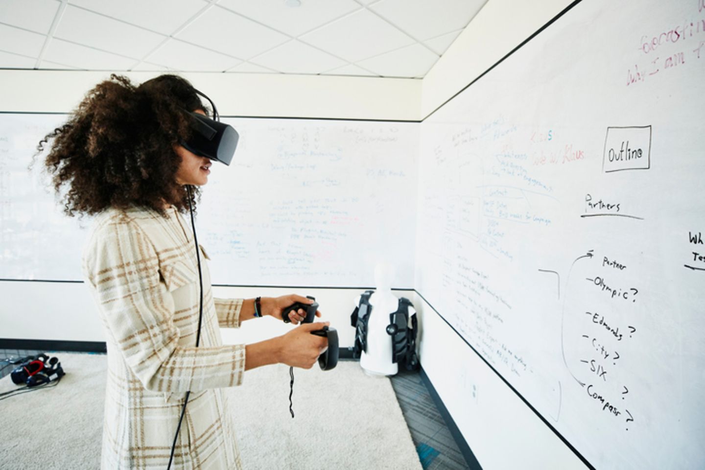 A woman tests a virtual reality headset