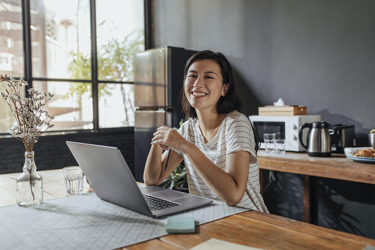 A woman working at home on a laptop