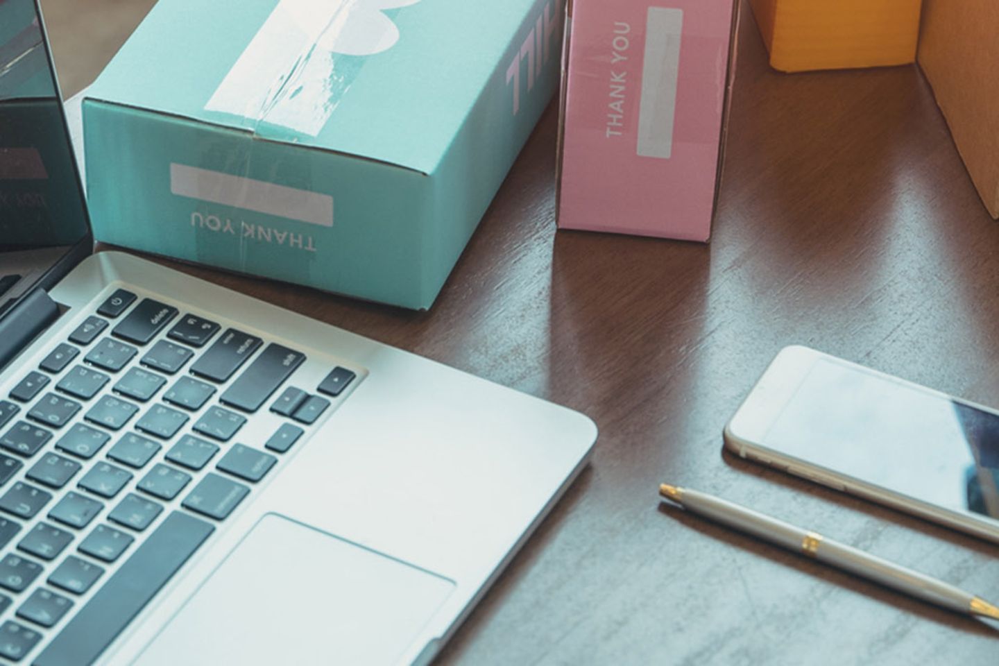 Laptop and various packages on a desk