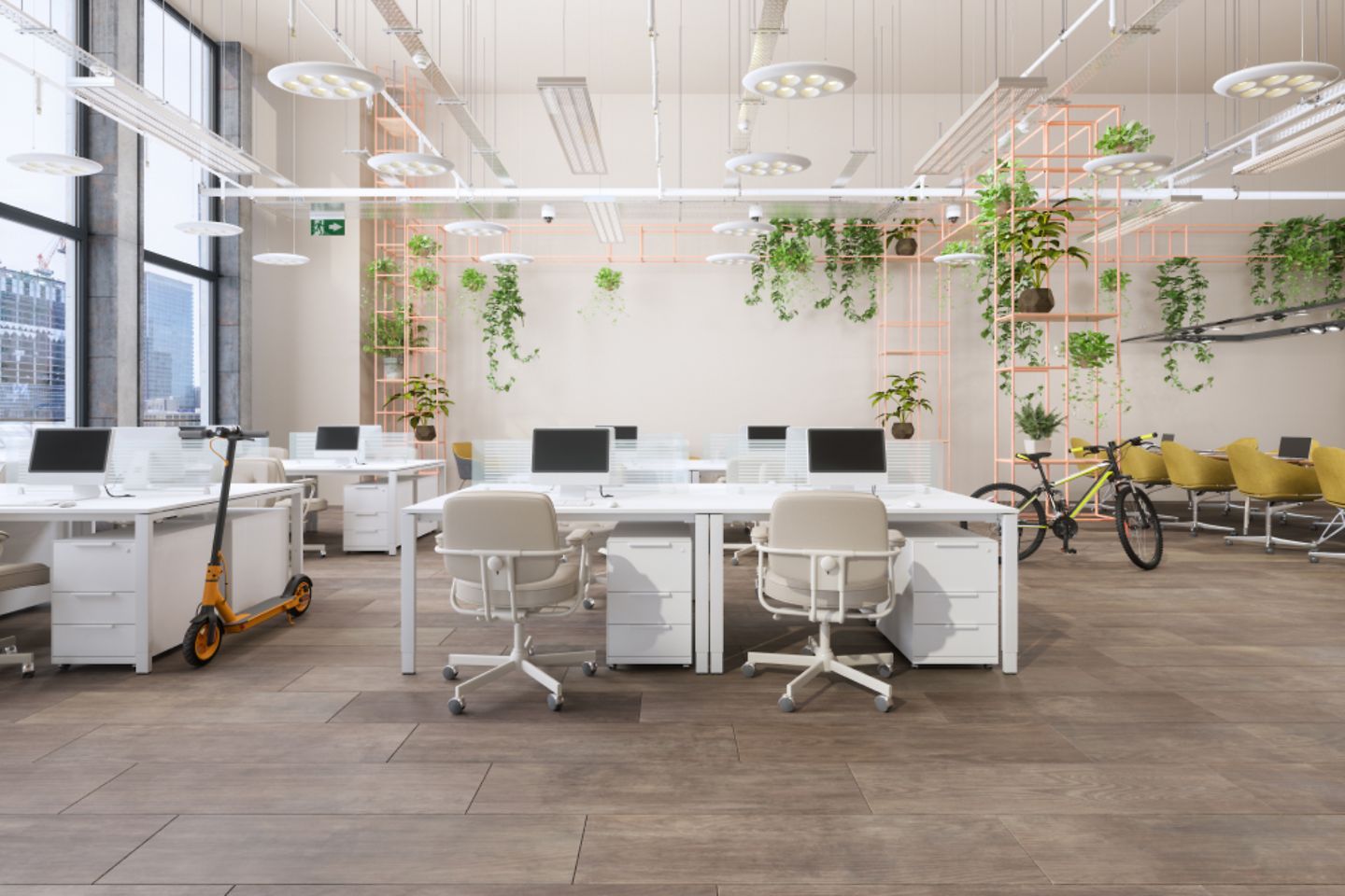 Open plan office with desks and screens.