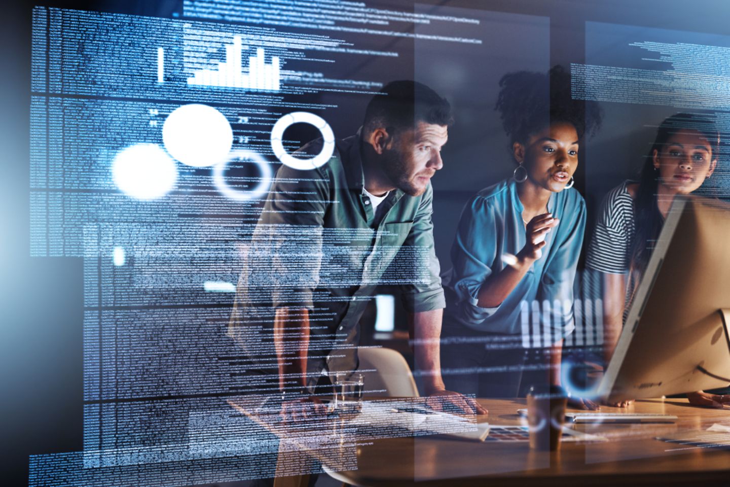 Three people looking at holographic screen showingdata information