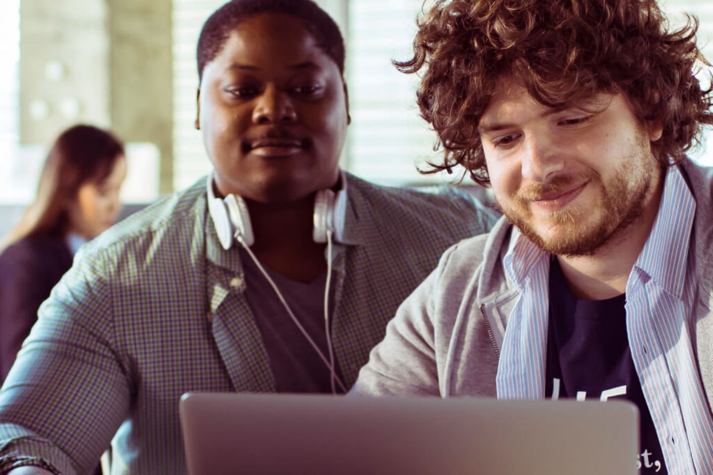 Close up of two colleagues working together in the office