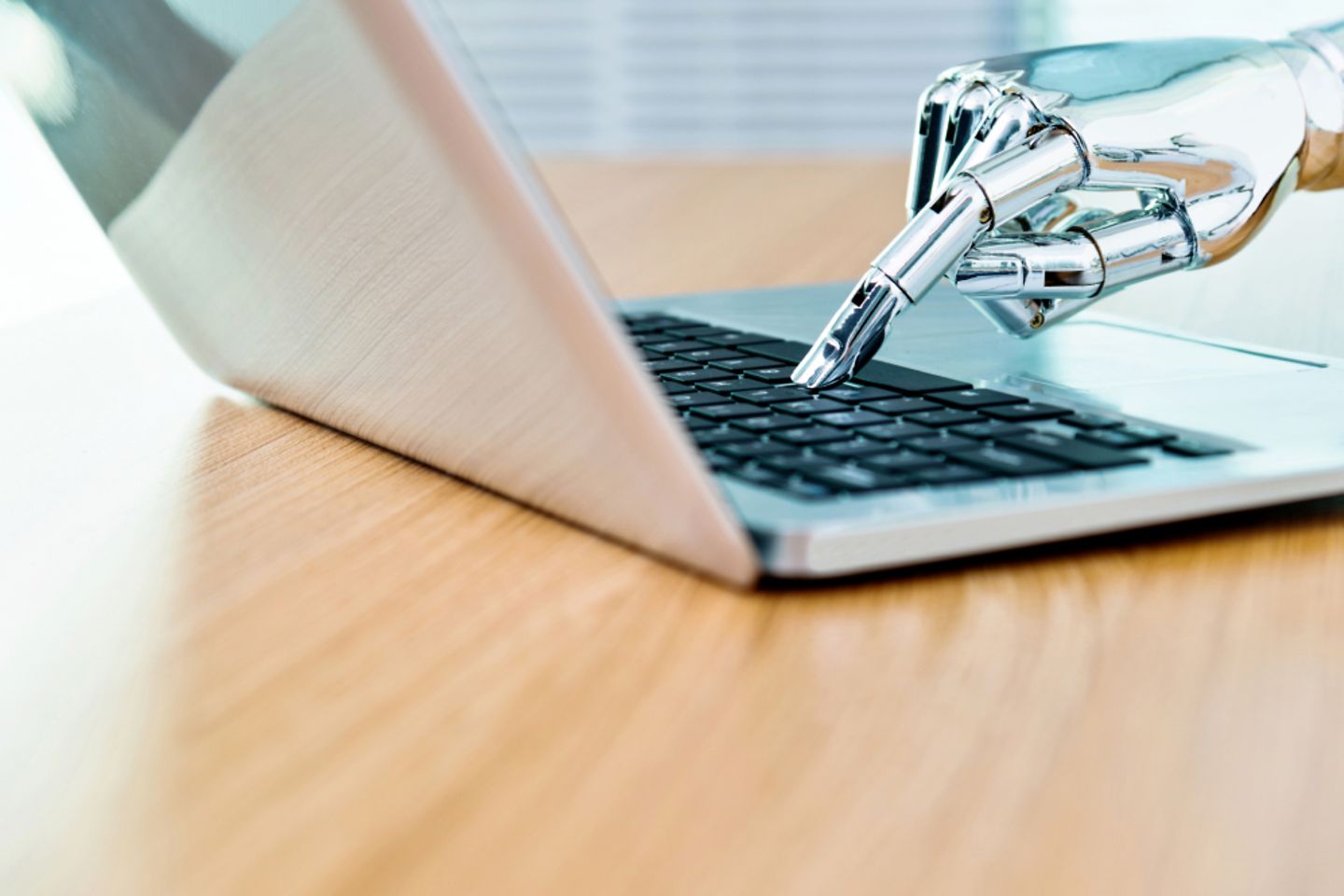 Robot hand types on keyboard