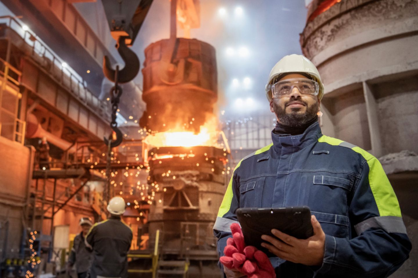 Portrait of a steel worker casting steel in steel factory