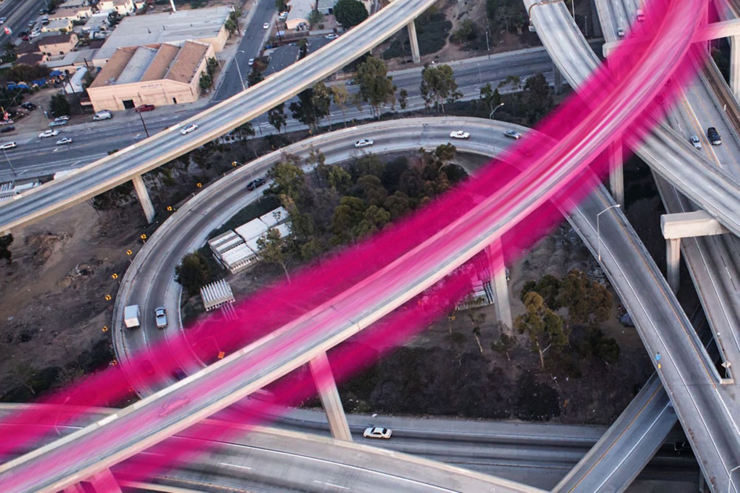Bridge with blurred magenta tail lights of cars
