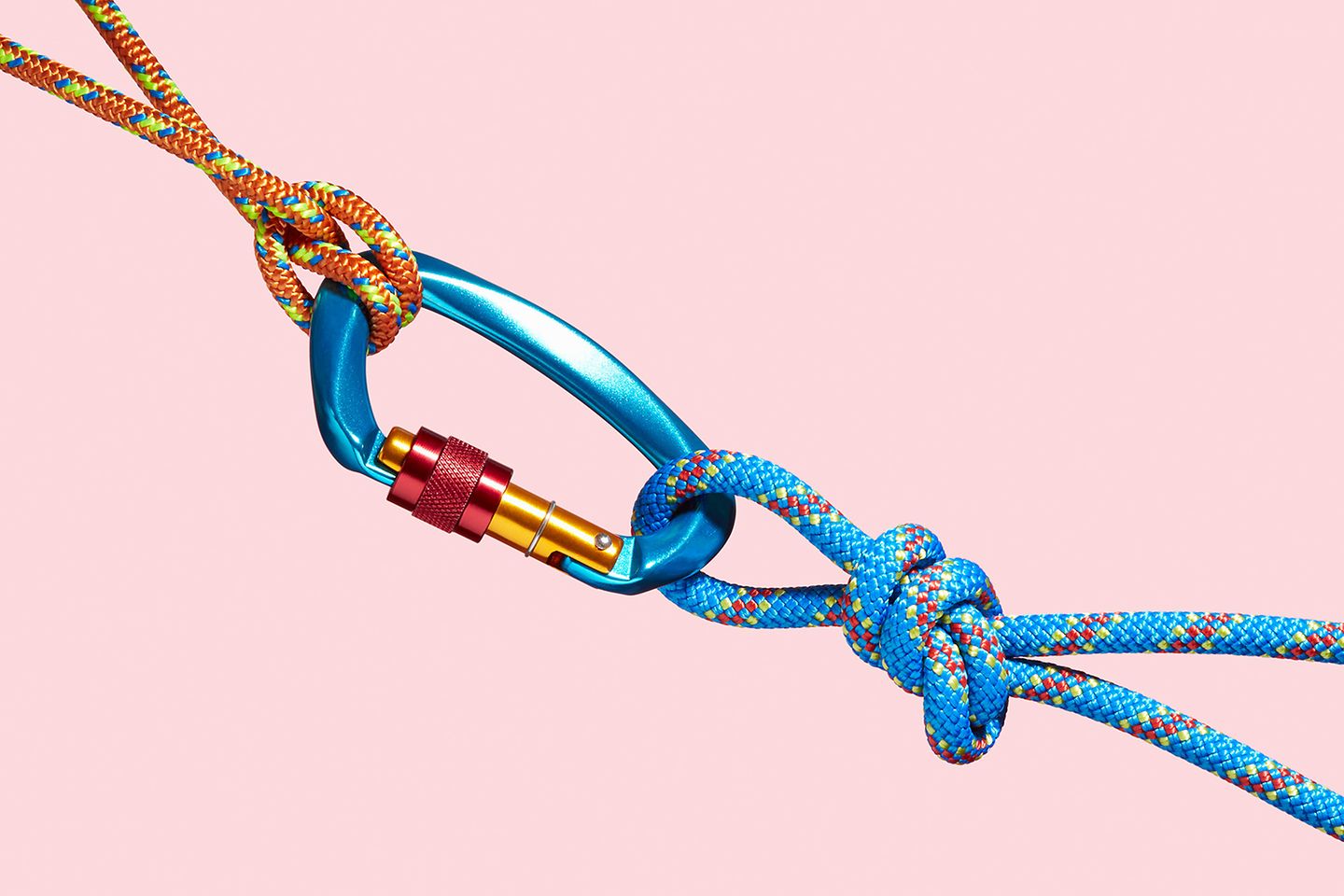 An orange and a blue rope with a karabiner in their loops