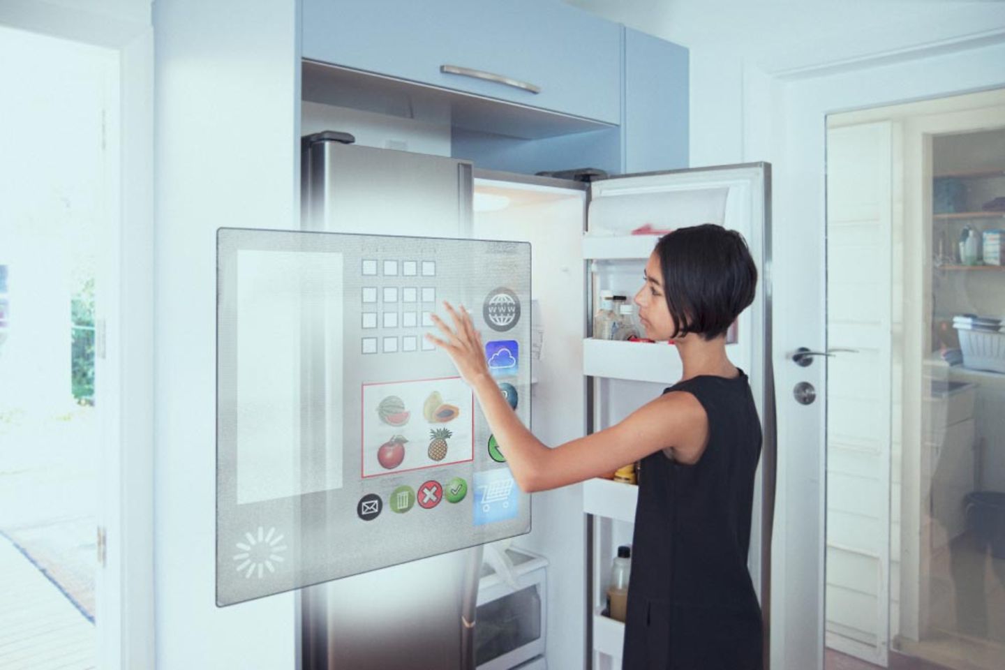 A woman stands in front of a refrigerator with virtual button