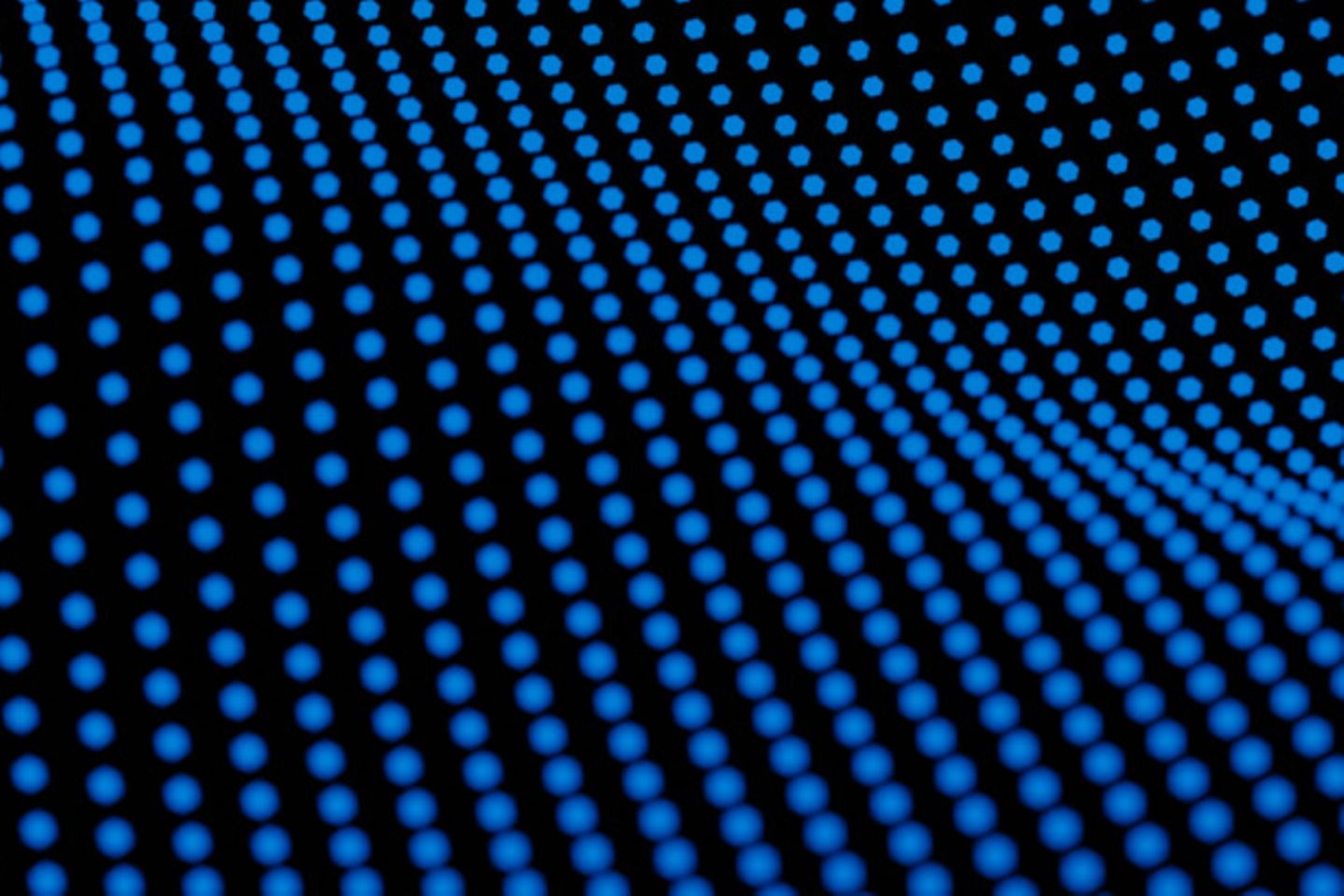 Blue Dots forming a wave on a black background