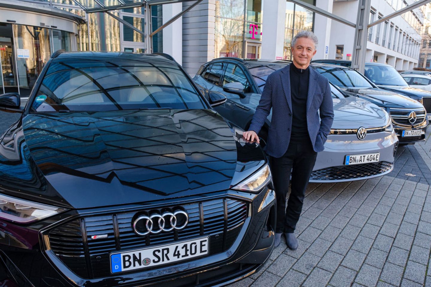 CEO Adel Al-Saleh in front of the T-Systems vehicle fleet