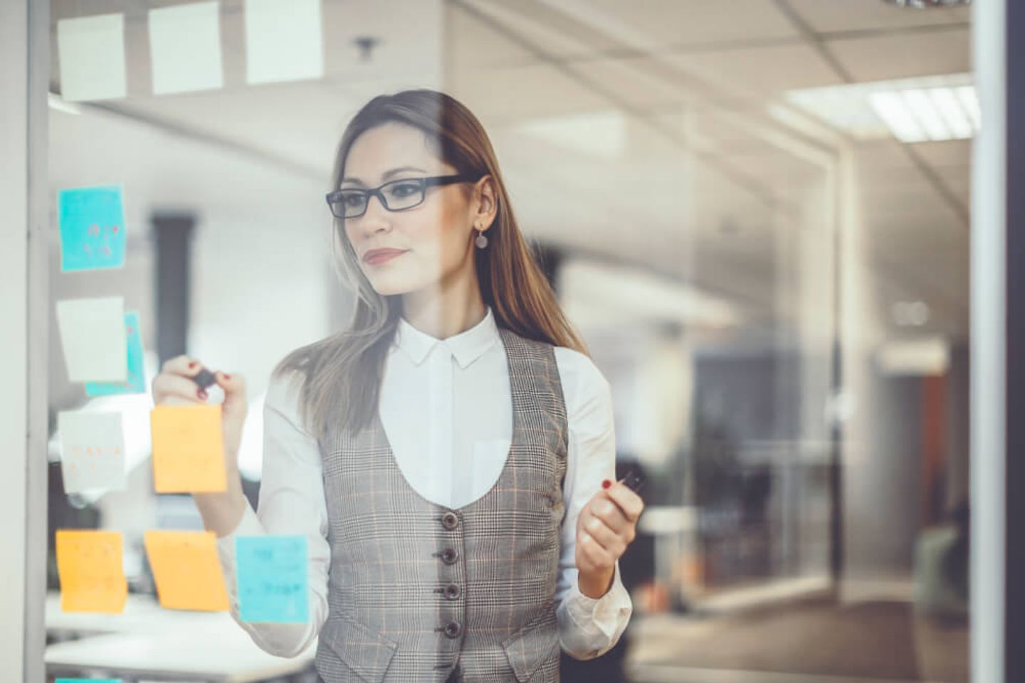  Woman in front of notice board